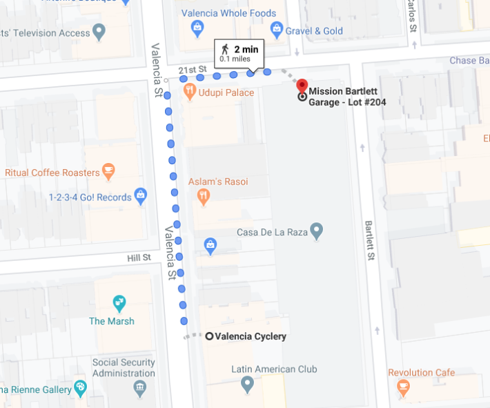 So if parking was banned in front of Valencia Cyclery, customers might have to walk two minutes from this nearby parking lot... if they can't find free parking on an adjoining street. Google maps.