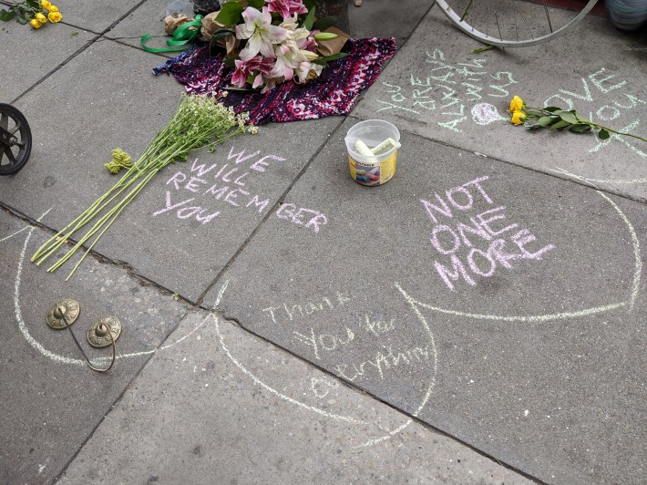 Mourners wrote in chalk and left flowers. Photo: Streetsblog/Rudick