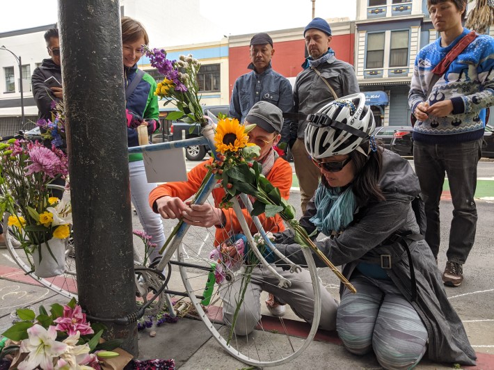 Advocates and friends stopped at 6th and Howard Sunday afternoon to remember Tess Rothstein