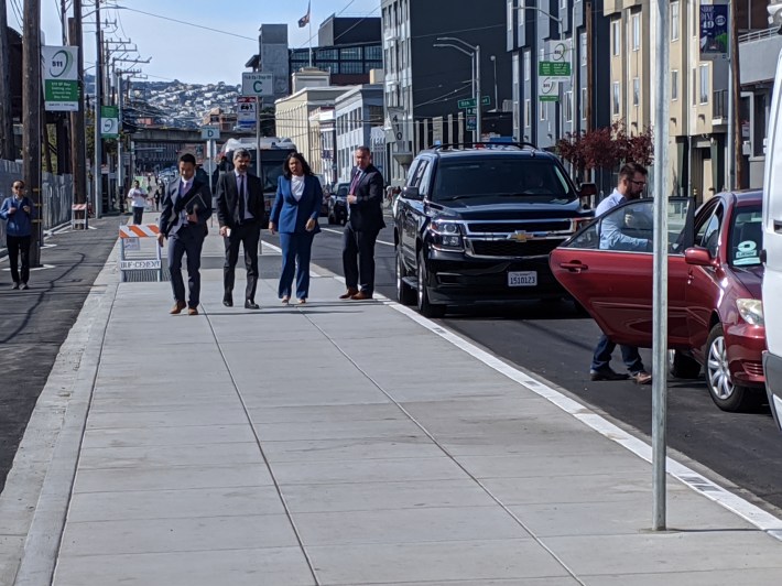 The Mayor and her detail arrived by giant SUV