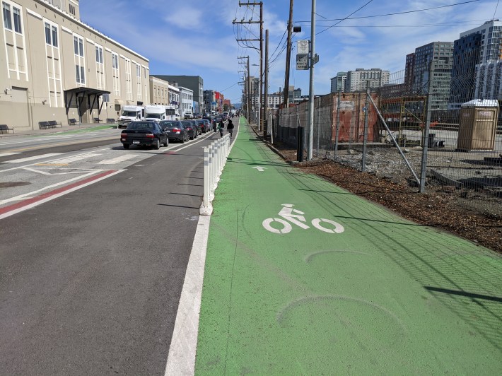 New paint and posts protect the bike lane in the eastern direction