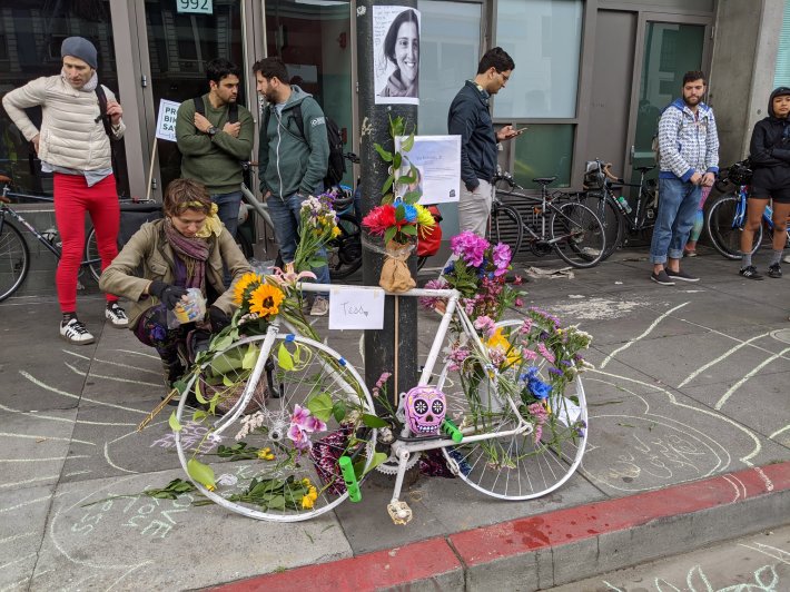 Tess Rothstein's ghost bike at Howard and 6th. Her friend Norna Ross is seen kneeling. Photo: Stephen Braitsch