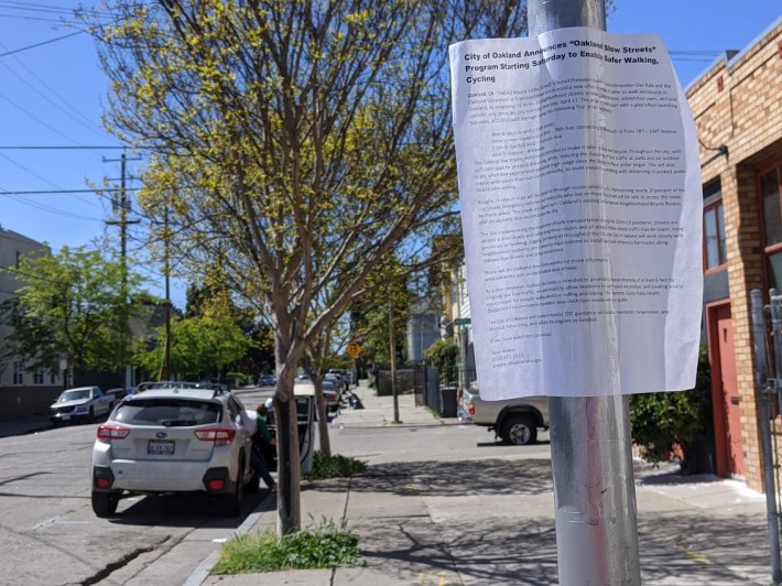 A simple paper sign taped to a pole in Oakland. Photo: Streetsblog/Rudick
