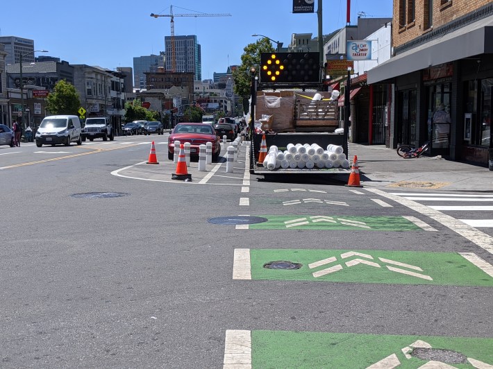 An OakDOT crew this afternoon installing better bollards