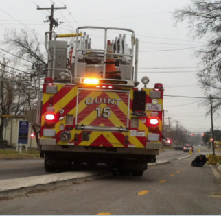 A fire truck in Austin, TX is able to mount a curb designed to deter motorists, but not stop emergency vehicles and trucks. Image: Alta