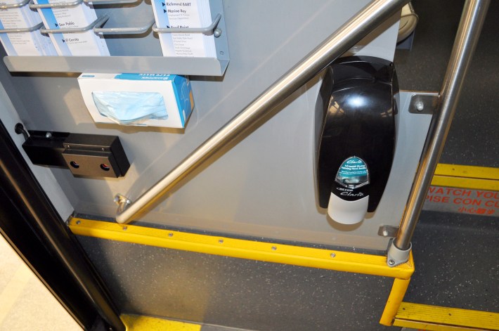 Masks and hand sanitizer dispensers. Photo: AC Transit