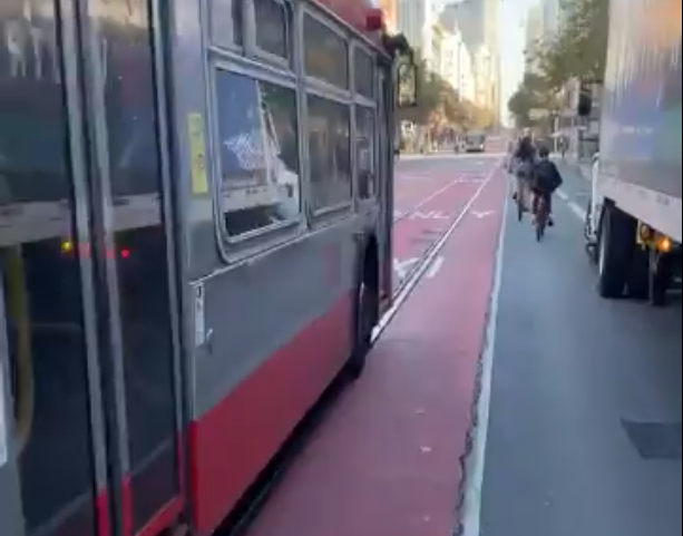 The point of view of a cyclist squeezed between 20 ton vehicles from a bike cam during a recent trip down 'car free' Market Street. Image: captured from Luke Spray's twitter