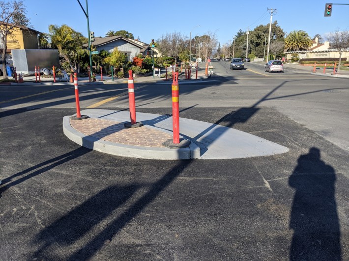 One of the "biscuits" with a dual-radius turn to force motorists to take turns slowly and carefully