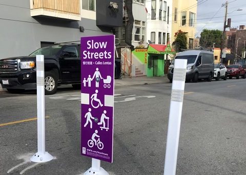 In a blatant end run around process, SFMTA staff eliminated the "no thru traffic" aspect of Slow Streets and installed these new signs. Image: SFMTA