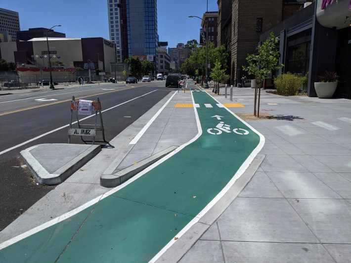 A recently installed concrete loading island on Telegraph. Photo: Streetsblog/Rudick