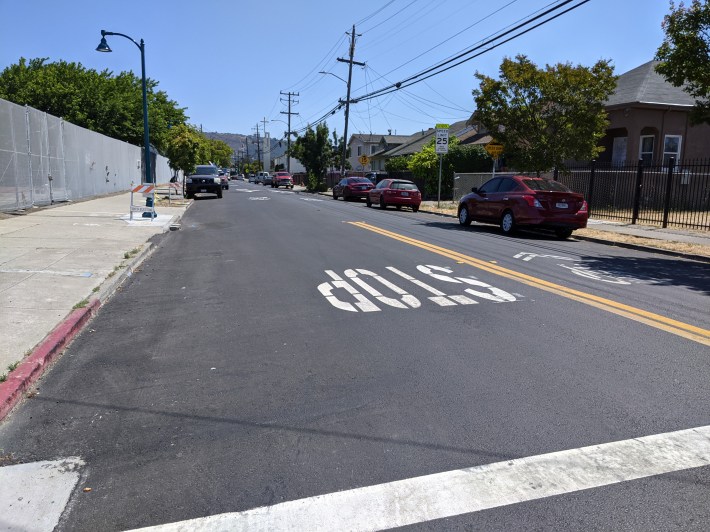 New asphalt on 69th. Brand new, but already showing early signs of degrading.