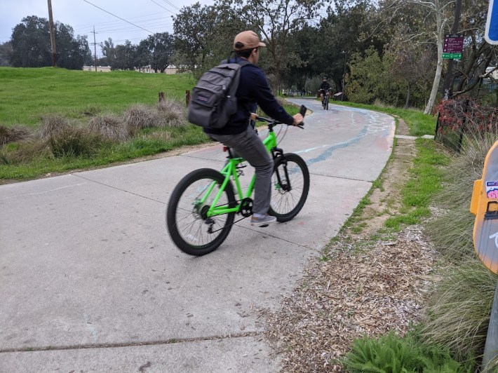 A cyclists riding on one of Davis's many off-street greenways. Photo: Streetsblog/Rudick