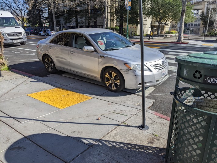 It's precisely because motorists don't follow the law that paint-only treatments don't work. Photo: Streetsblog/Rudick