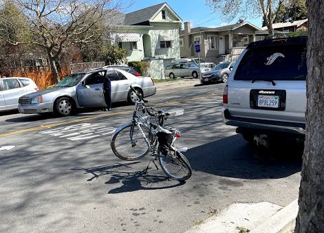 Erbe's bicycle right after the crash. Note the front windshield of the car that hit her. Photo by Erbe's husband.