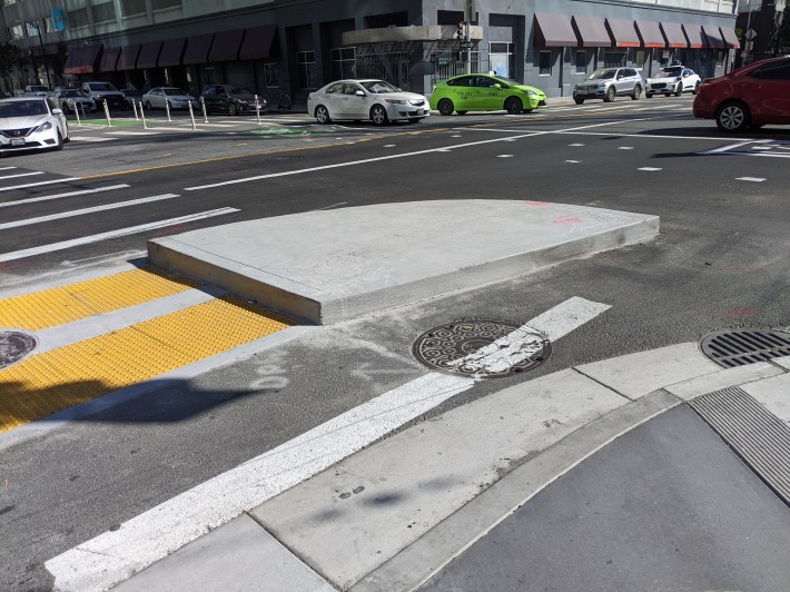 A protected corner is under construction at Howard and 5th