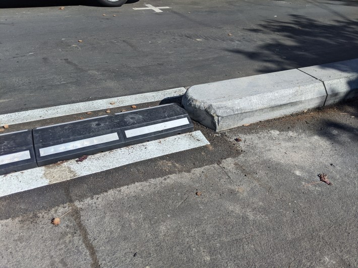A look at the mountable curb (left) and the concrete curb it replaced (right)