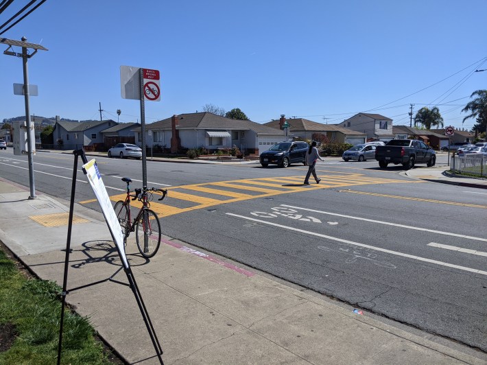 The crosswalk in front of the school is well marked and has in-street flashers. It really should be narrowed and raised as well. Photo: Streetsblog/Rudick