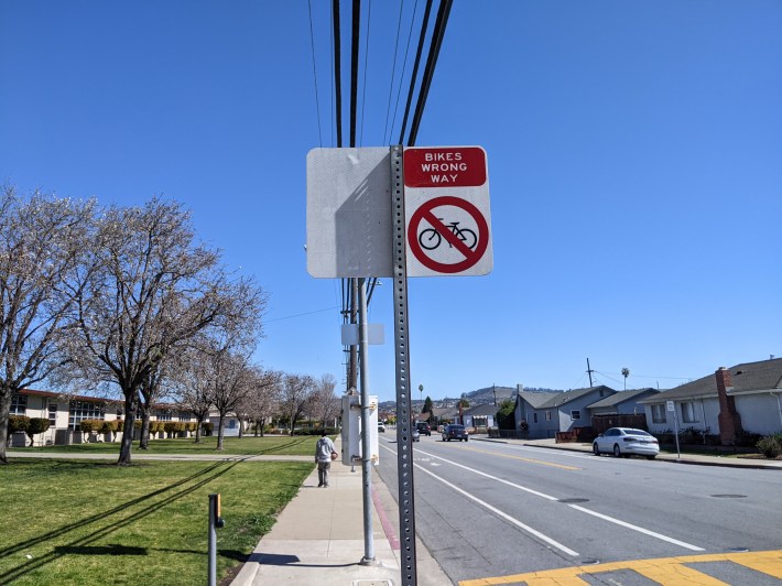 Current configuration in front of the school. A teacher who was on the ride wants this one block to permit contra-flow cycling so kids don't have to cross the street twice to go west. Photo: Streetsblog/Rudick