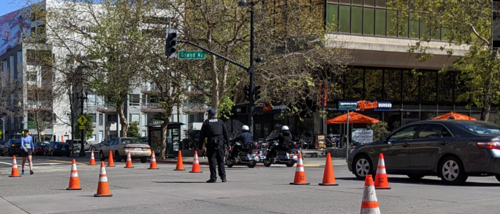 OPD directing cars through intersections on car-free Broadway