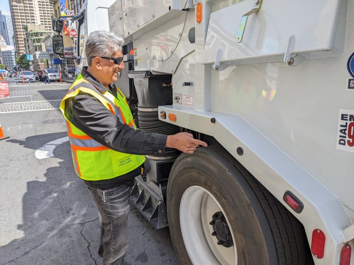 Arnie Romero with S.F. Public works pointing to one of the new alarm sensors