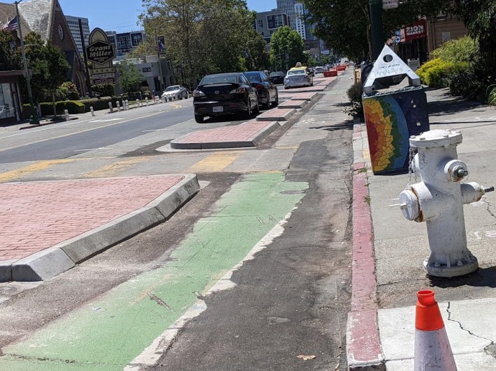 Photo taken May 30 of the Telegraph protected bike lane getting its final concrete treatments. Photo: Streetsblog/Rudick