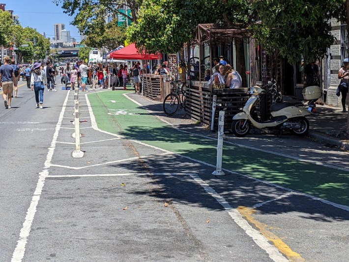 Where the post-protected bike lane diverts around Four Barrell Coffee's parklet