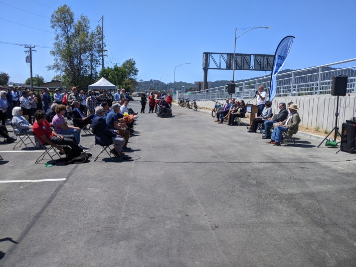 The event was held in a parking lot near one of the landings of the new bridge.