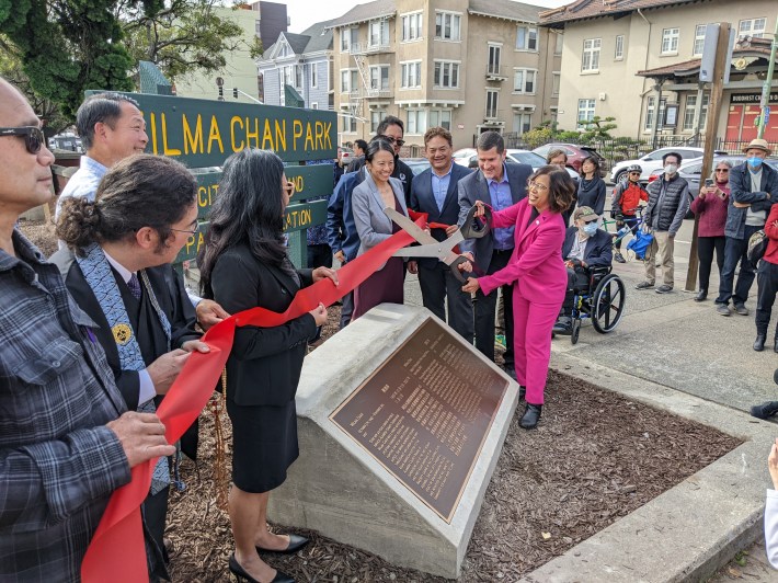 Council President Nikki Fortunato Bas cutting the ribbon for the new sign and plaque