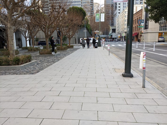 There seriously isn't enough space to segregate out a bike lane at sidewalk level? The infa's already here. Photo: Streetsblog/Rudick