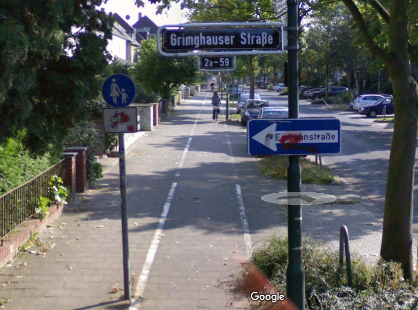 A "quick build" bike lane put on a wide sidewalk in Dusseldorf. Image: Google maps