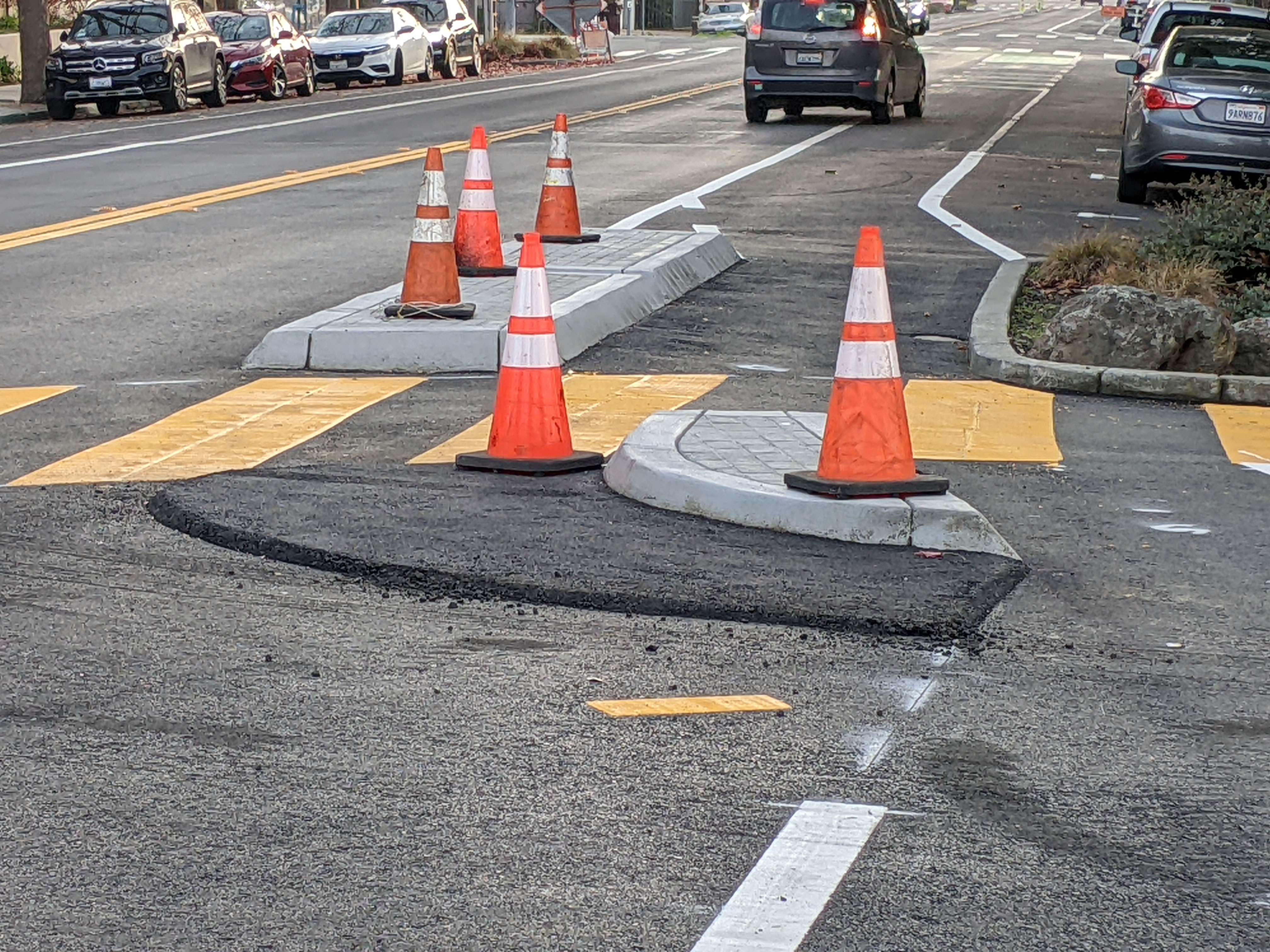 Note the raised asphalt in front of the curb to warn motorists to slow down