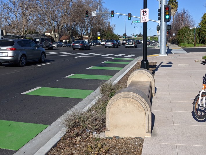 Giant concrete barriers--on the wrong side of an unprotected bike lane?