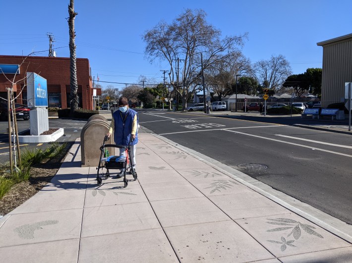 I'm sure this senior appreciates the sidewalk stencils as he struggles to get around