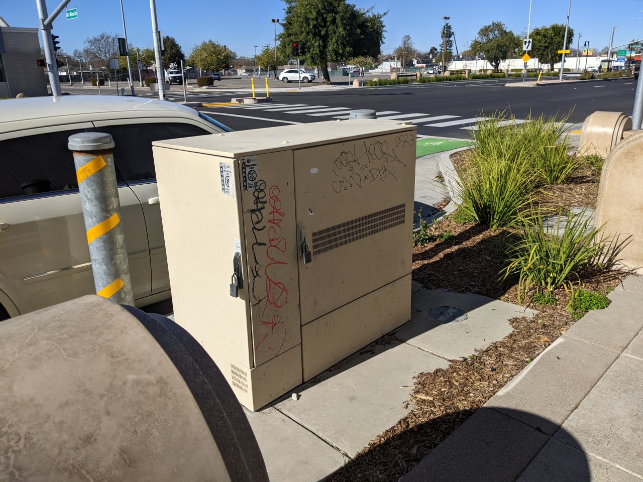 Note the heavy steel post to the right of this utility box--protect a utility box but not people? Very Alameda County