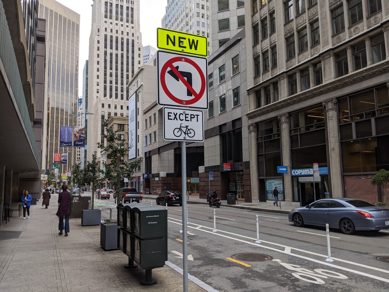 A section of bike lane on Battery that SFMTA repeatedly calls "protected," when it consists of nothing but plastic posts right next to moving lanes of traffic