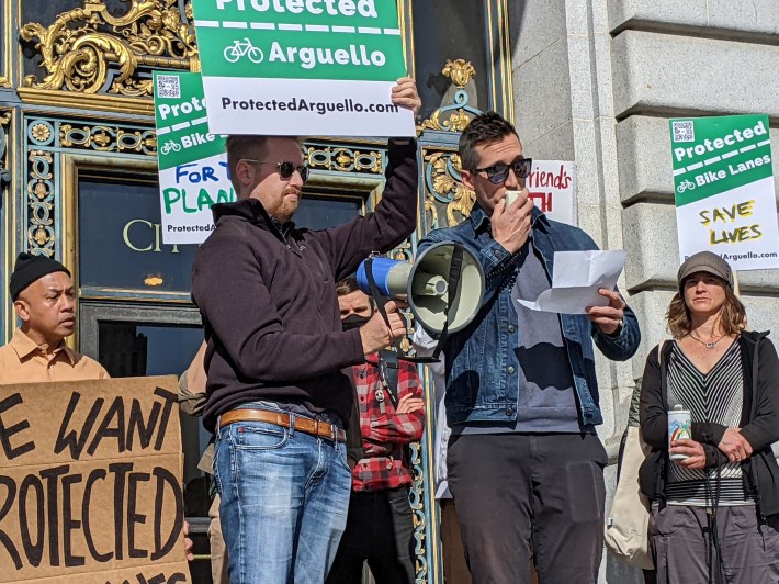 Boyes's friend Grady at the mic at Tuesday morning's rally