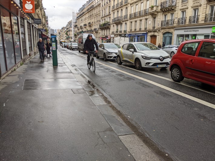 One of Paris's *less* impressive installations, a standard parking protected bike lane