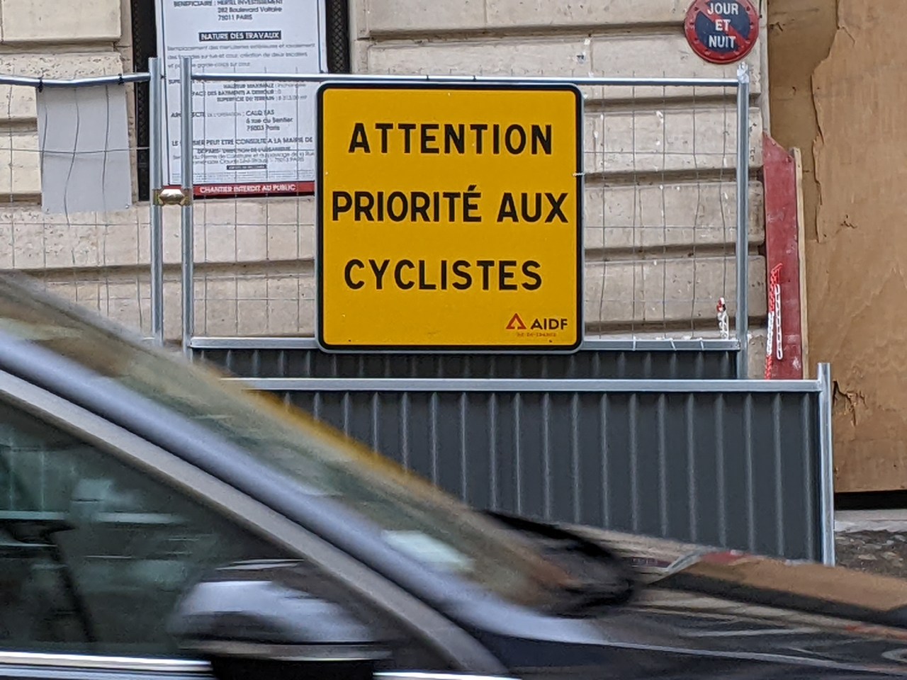 "Attention: the priority is for cyclists." Paris is doing this: literally, on the street, and in concrete. Photos: Streetsblog/Rudick unless indicated