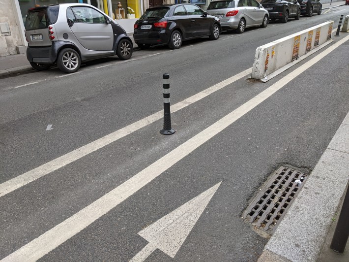 After a white K-71, Parisian drivers get a last warning--another plastic posts designed to look like the ubiquitous black steel bollards one finds in Paris